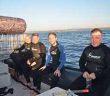 Preparing for a Shark Cage dive at Rocky Bay beach in KwaZulu Natal during Indaba 2013, Emma Gregg African specialist travel writer, Eoghan Corry editor of Travel Extra, Patrick Welch of The Metro, and Ian Mallory travel blogger