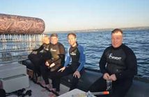 Preparing for a Shark Cage dive at Rocky Bay beach in KwaZulu Natal during Indaba 2013, Emma Gregg African specialist travel writer, Eoghan Corry editor of Travel Extra, Patrick Welch of The Metro, and Ian Mallory travel blogger