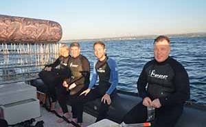 Preparing for a Shark Cage dive at Rocky Bay beach in KwaZulu Natal during Indaba 2013, Emma Gregg African specialist travel writer, Eoghan Corry editor of Travel Extra, Patrick Welch of The Metro, and Ian Mallory travel blogger