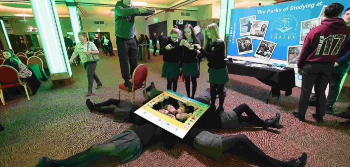 Students Barra O'Siochru, Katie Tobin and Laura Hynes from the Gael Cholaiste in Tralee and classmates take part in the mannequin challenge with 250 other students in the INEC Killarney. Photo: Domnick Walsh © Eye Focus Ltd