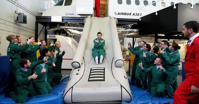 Pictured practising her evacuation slide drill is new recruit Leah Duffy-Stevenson. Picture Jason Clarke