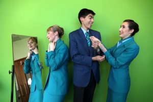 Pictured trying on their cabin crew uniform are Aoife Sullivan, Pedro Barros and Leah Duffy-Stevenson. Picture Jason Clarke