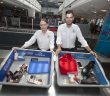 Dublin Airport Security Screening Officers Michelle Halpin and Sergio Rocha with a sample of what passengers should place in the trays at screening