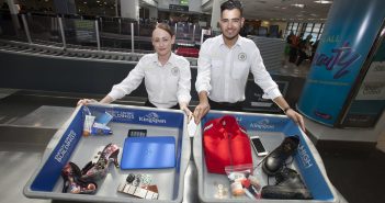 Dublin Airport Security Screening Officers Michelle Halpin and Sergio Rocha with a sample of what passengers should place in the trays at screening