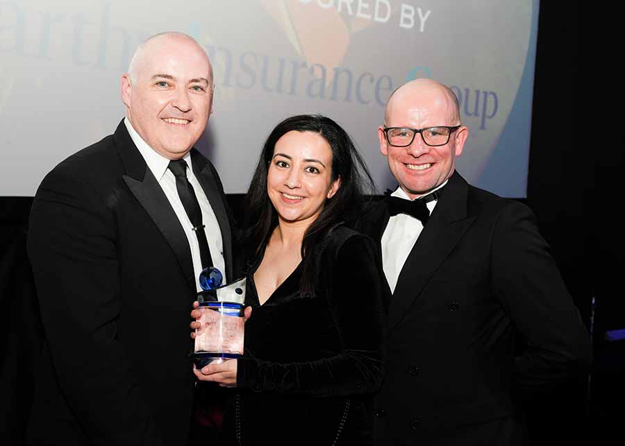 Category sponsor Mark Duggan of McCarthy Insurance presents the award for best worldwide theme park to Grant Daley and Steph Kyriacou of Universal, Irish Travel Industry Awards, Round Room Mansion House, January 25 2024