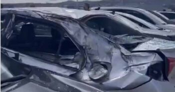 Cars damaged by missing wheel of Boeing 777-222ER) aircraft at San Francisco.