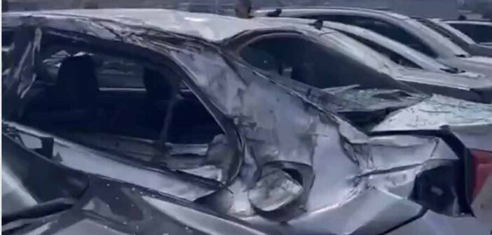 Cars damaged by missing wheel of Boeing 777-222ER) aircraft at San Francisco.