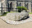 Saint Patrick's grave in Downpatrick, where local landowner Hugh de Lacy miraculously discovered the body and ham him reinterred alongside saints Brigid and Colmcille in 1185, shortly after he had seized the kingdom from the Irish