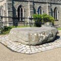 Saint Patrick's grave in Downpatrick, where local landowner Hugh de Lacy miraculously discovered the body and ham him reinterred alongside saints Brigid and Colmcille in 1185, shortly after he had seized the kingdom from the Irish