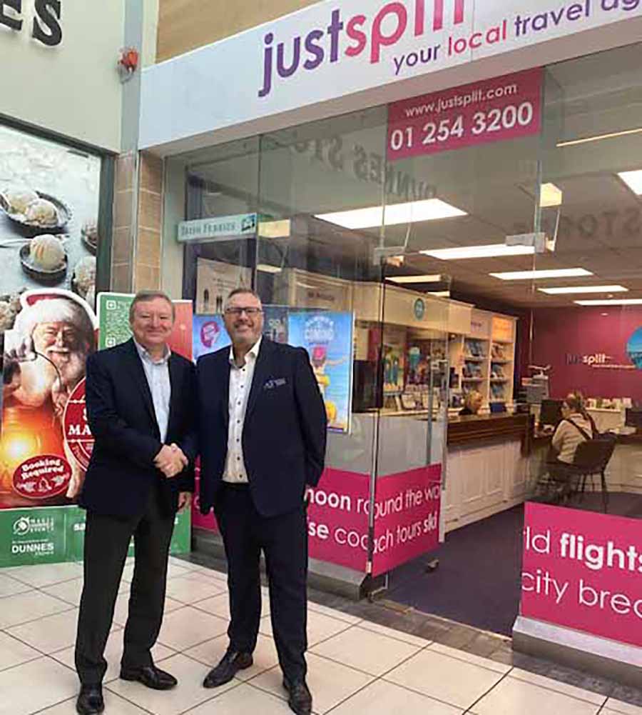 Jeff Collins and Jim Vaughan shake hands on the deal