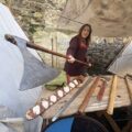 Viking maiden Barbara Power of the Déise medieval history group show off her axe at Winterval Waterford 2025