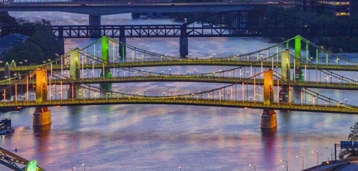 Three Sisters Bridges in green, white and orange to celebrate the launch of the direct Aer Lingus Dublin to Pittsburgh route in May 2026