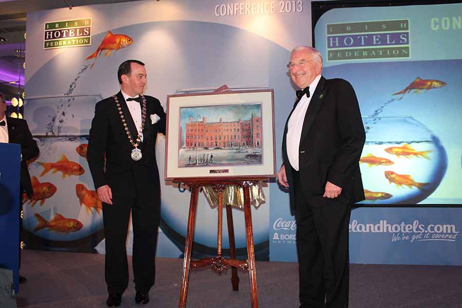 Martin Naughton receiuves the presdient's award form Michael Vaughan at the 2013 IHF conference