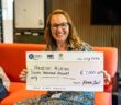 Office Manager and Head of Charity at Riviera Travel, Jane Walker, presenting Practical Action with a cheque for £7,000