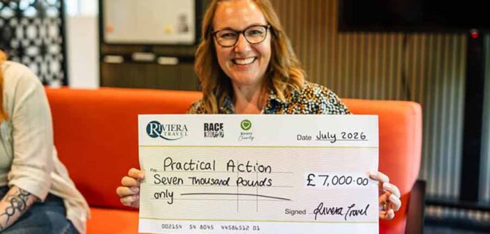 Office Manager and Head of Charity at Riviera Travel, Jane Walker, presenting Practical Action with a cheque for £7,000
