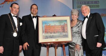 Martin Naughton and wife Carmel with Leo varadkar and Michael Vaughan, receiving the president's award at the 2013 IHF ocnference in Killarney