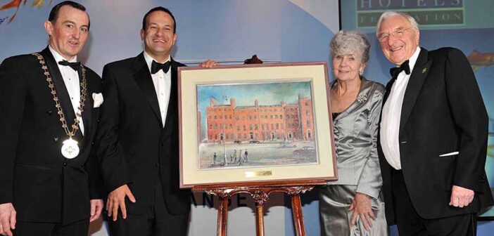 Martin Naughton and wife Carmel with Leo varadkar and Michael Vaughan, receiving the president's award at the 2013 IHF ocnference in Killarney